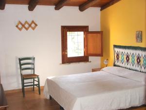 Giường trong phòng chung tại Casale Corcella
