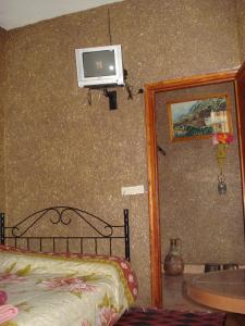Rúm í herbergi á Auberge Gitelkst