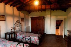 Łóżko lub łóżka w pokoju w obiekcie Agriturismo Marchesi Gondi