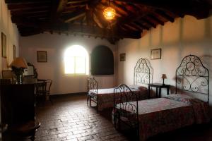 Łóżko lub łóżka w pokoju w obiekcie Agriturismo Marchesi Gondi