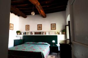 Postel nebo postele na pokoji v ubytování Agriturismo Marchesi Gondi