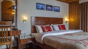 Postel nebo postele na pokoji v ubytování Hotel Shangrila Regency
