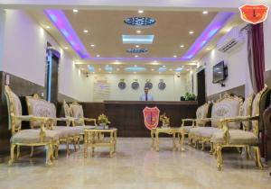 a waiting room with chairs and a podium at Maamoura Armed Forces Apartments in Alexandria +62 photos