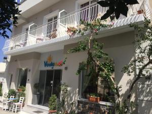 a view of the outside of a white building at Voula Hotel in Hersonissos