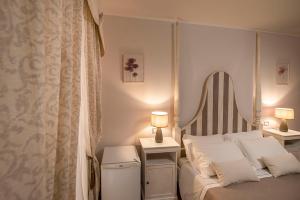 A bed or beds in a room at Vico d'Ercole