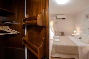 A bed or beds in a room at Vico d'Ercole Még 37 kép