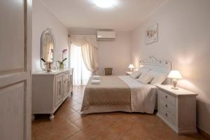 A bed or beds in a room at Vico d'Ercole