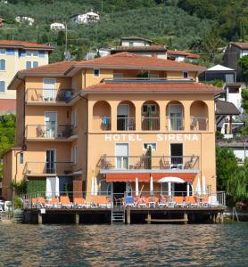a hotel on a dock on the water at Hotel Sirena in Malcesine