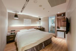 Letto o letti in una camera di RF Hotel - Zhongxiao