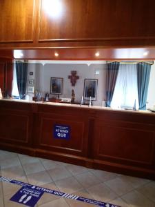 a trial court courtroom with a sign on it at casapaceebene in San Giovanni Rotondo
