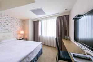 Letto o letti in una camera di RF Hotel - Zhongxiao