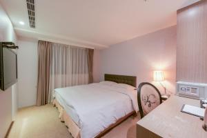 Letto o letti in una camera di RF Hotel - Zhongxiao