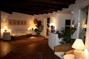 a living room with a couch and a table at Hotel Villa Mediterranea in Noto Marina