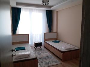 Voodi või voodid majutusasutuse Çınar Residance toas