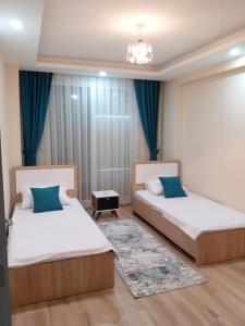 Un pat sau paturi într-o cameră la Çınar Residance
