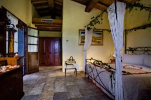 Posteľ alebo postele v izbe v ubytovaní Villa Hotel Valle Del Marta Resort + 37 fotografií