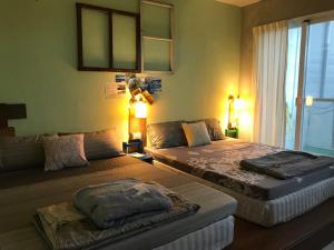 Cama o camas de una habitación en 池上5159懷舊民宿 請勿用阿勾達訂房