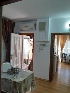 a room with a table and a room with a door at Casa Silvia in Constanţa