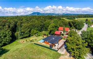 an aerial view of a house with a tennis court at Crab's Creek Zagreb in Rakov Potok