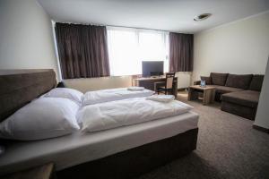 Posteľ alebo postele v izbe v ubytovaní Hotel Cargo