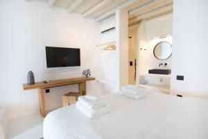 Postel nebo postele na pokoji v ubytování Obsession Mykonos