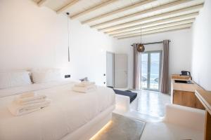 Postel nebo postele na pokoji v ubytování Obsession Mykonos + 37 fotografií