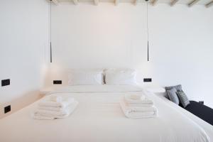 Postel nebo postele na pokoji v ubytování Obsession Mykonos