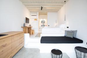 Postel nebo postele na pokoji v ubytování Obsession Mykonos