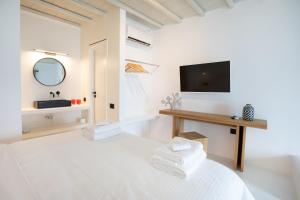 Postel nebo postele na pokoji v ubytování Obsession Mykonos