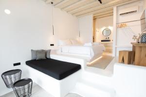 Postel nebo postele na pokoji v ubytování Obsession Mykonos