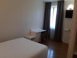 Postel nebo postele na pokoji v ubytování Hotel B&B Fortuna