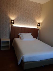 Postel nebo postele na pokoji v ubytování Hotel B&B Fortuna
