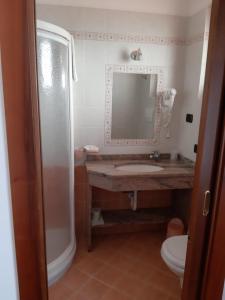 Koupelna v ubytování Hotel B&B Fortuna