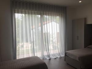 Posteľ alebo postele v izbe v ubytovaní La Casa nel Verde