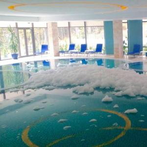 an office building with a floor covered in clouds at Hotel Hart in Predeal