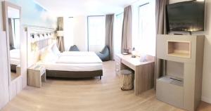 Ein Bett oder Betten in einem Zimmer der Unterkunft Hotel Altes Zollhaus