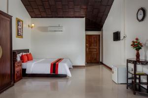 Postel nebo postele na pokoji v ubytování Angkor Mithona Guesthouse