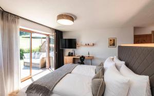Voodi või voodid majutusasutuse Chalet Grumer Suites&Spa toas