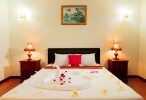 Postel nebo postele na pokoji v ubytování Angkor Mithona Guesthouse