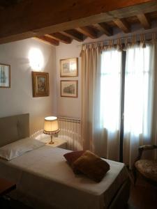 a bedroom with a bed and a window at Mare Colline Relax in Montignoso
