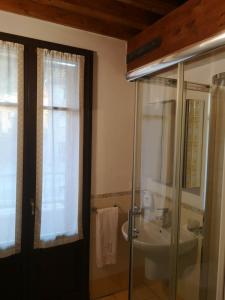 a bathroom with a sink and a glass shower at Mare Colline Relax in Montignoso