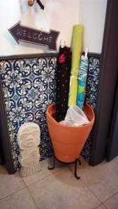 a bucket sitting on the floor next to a wall at Rua 5 House in Gafanha da Vagueira +38 photos