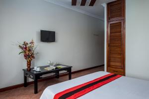 Postel nebo postele na pokoji v ubytování Angkor Mithona Guesthouse
