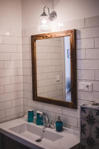 a bathroom with a sink and a mirror at Mathias Rex in Szentendre