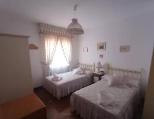 Ένα ή περισσότερα κρεβάτια σε δωμάτιο στο Casa Navacastellanos
