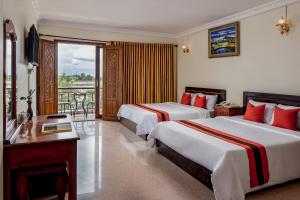 Postel nebo postele na pokoji v ubytování Angkor Mithona Guesthouse