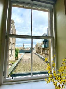 a window with a view of a city street at Advocates Apartment in Edinburgh