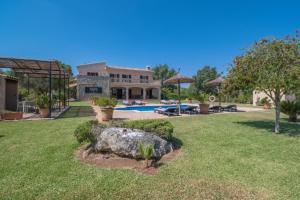 a villa with a swimming pool and a yard at G324 Vela 1 by Mallorca Villa Selection in Muro