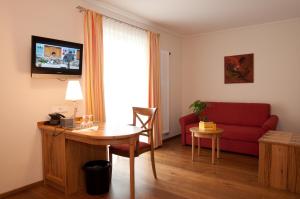 TV a/nebo společenská místnost v ubytování Hotel & Gasthof Löwen