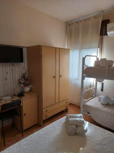 A bed or beds in a room at Albergo Ristorante Bar Pizzeria La Lanterna